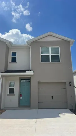 a view of a house with a garage