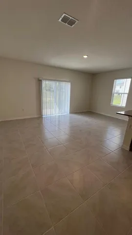 a view of an empty room with a window