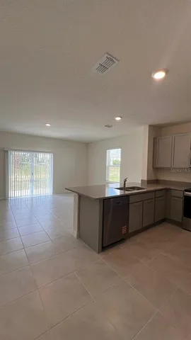 a living room with a couch and a window