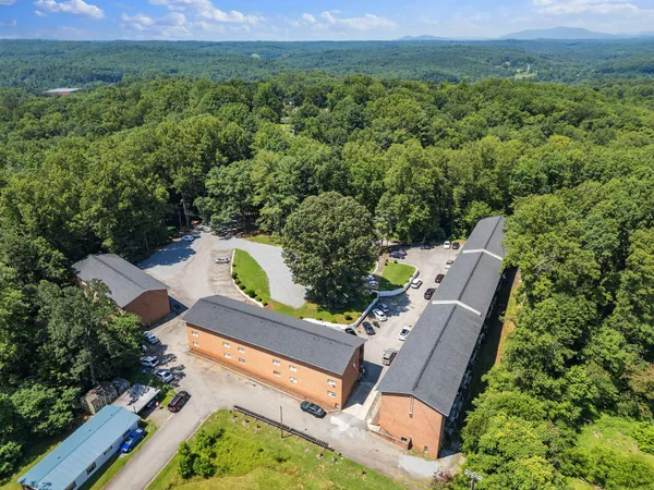 an aerial view of a house with a yard