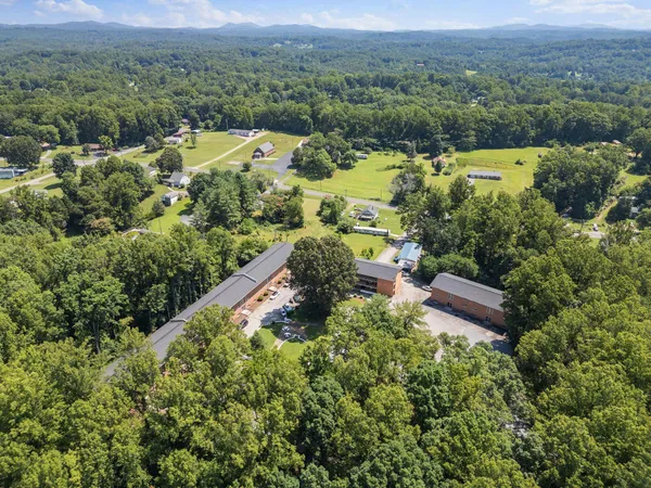an aerial view of a house with a garden