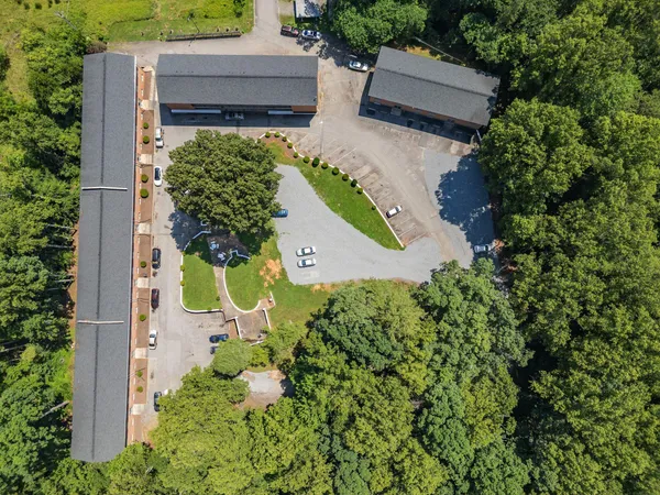 an aerial view of a house with a yard and garden