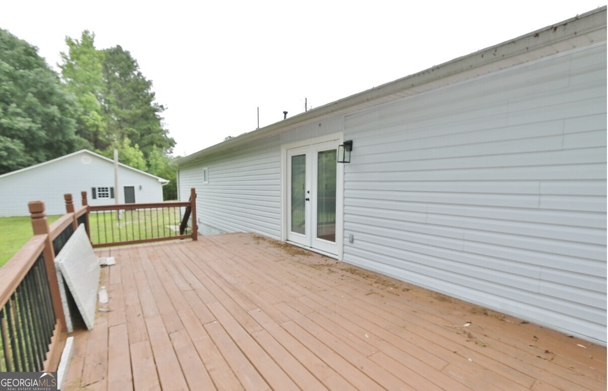 3434 Union Point Road Union Point, GA 30669 - Photo 18 of 23 a view of a house with wooden deck