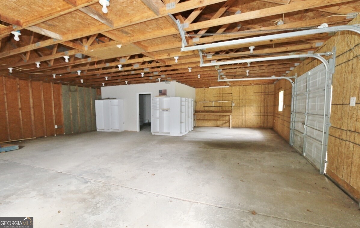 3434 Union Point Road Union Point, GA 30669 - Photo 21 of 23 a view of a room with wooden walls