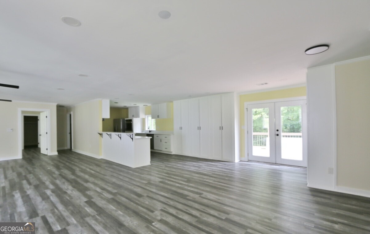 3434 Union Point Road Union Point, GA 30669 - Photo 4 of 23 a view of a kitchen with furniture and wooden floor