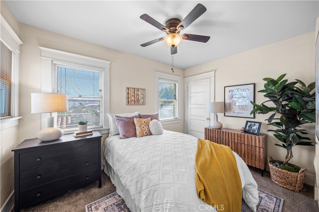 347 Euclid Avenue Long Beach, CA 90814 - Photo 28 of 41 a bed room with a bed and a chandelier