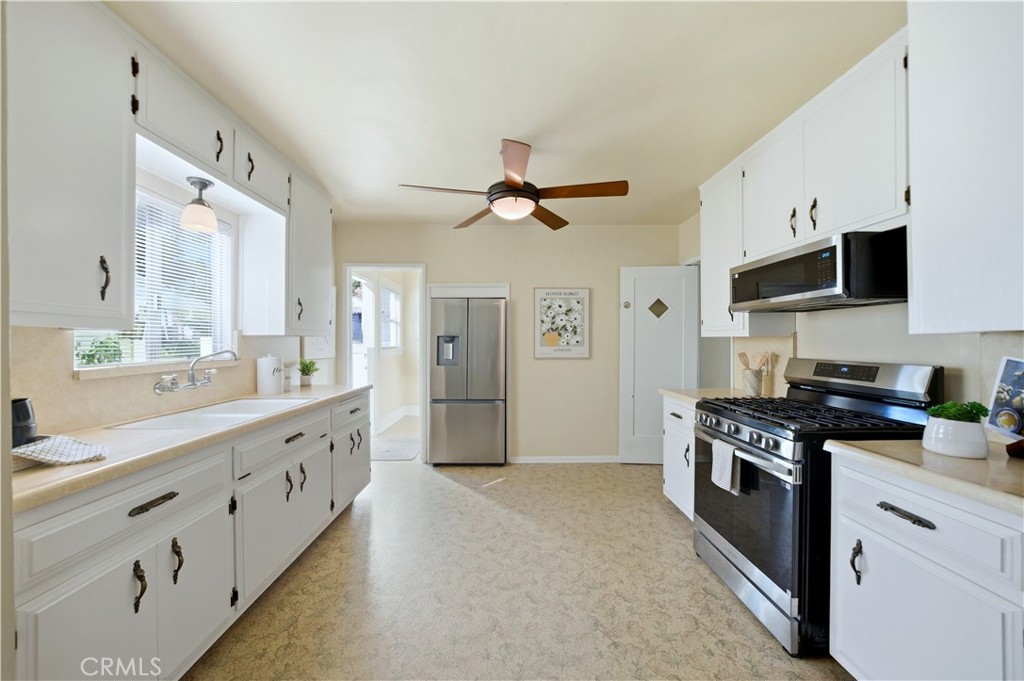 347 Euclid Avenue Long Beach, CA 90814 - Photo 6 of 41 a kitchen with stainless steel appliances granite countertop a stove a sink and a refrigerator