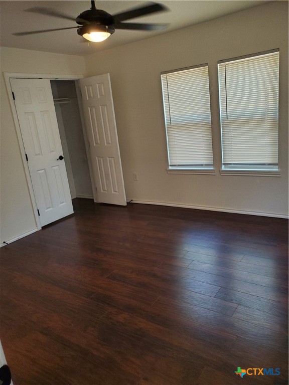 826 North Bowie Street Seguin, TX 78155 - Photo 7 of 9 an empty room with wooden floor and windows