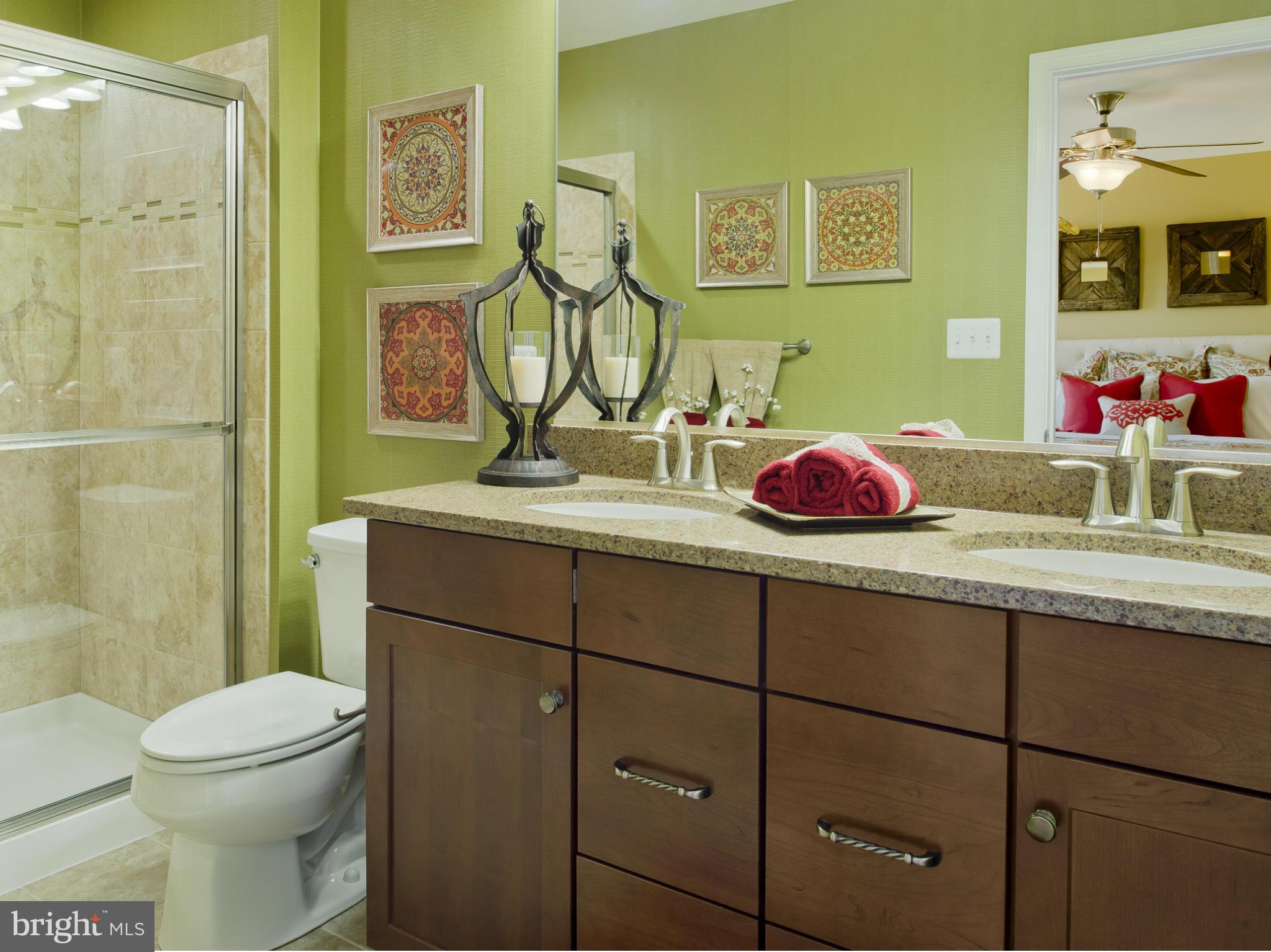 908 Sandy Run Road Middle River, MD 21220 - Photo 11 of 24 a bathroom with a sink vanity mirror and toilet
