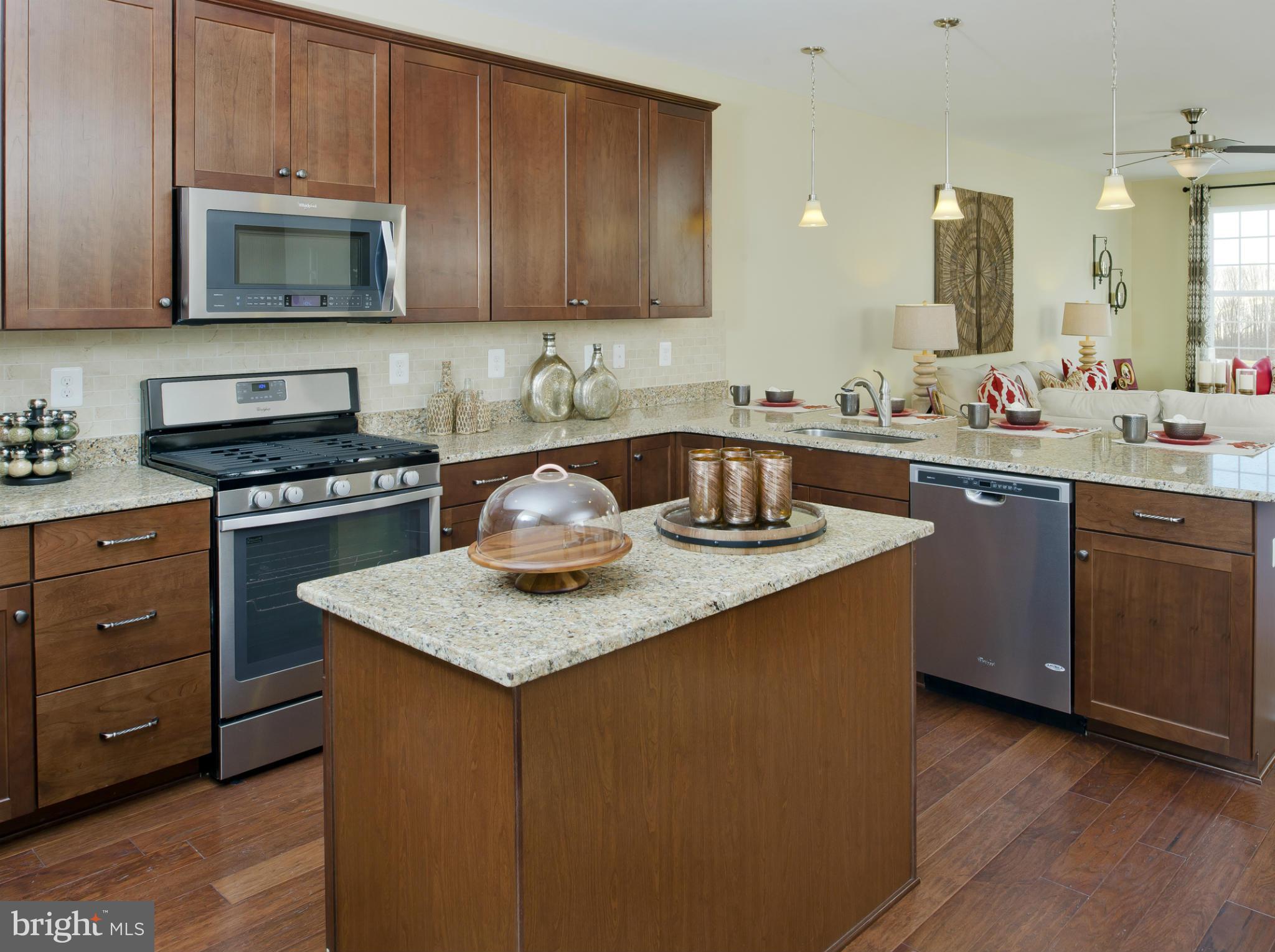 908 Sandy Run Road Middle River, MD 21220 - Photo 6 of 24 a kitchen with a sink a stove and cabinets