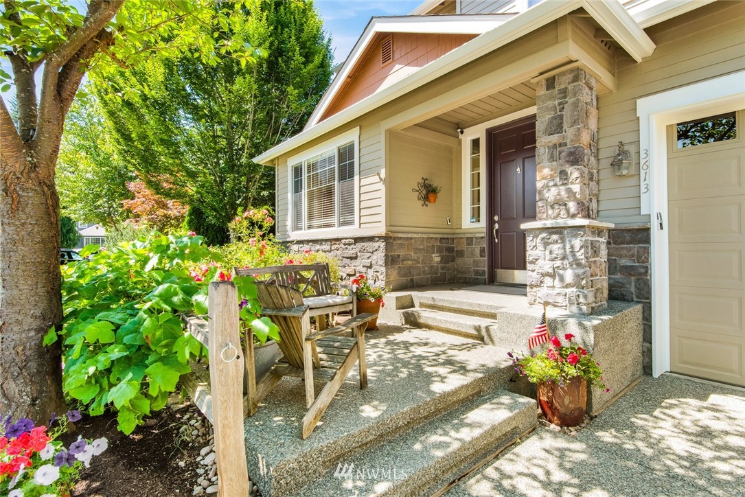 3613 209th Place Southeast Bothell, WA 98021 - Photo 2 of 28 a front view of a house with outdoor seating