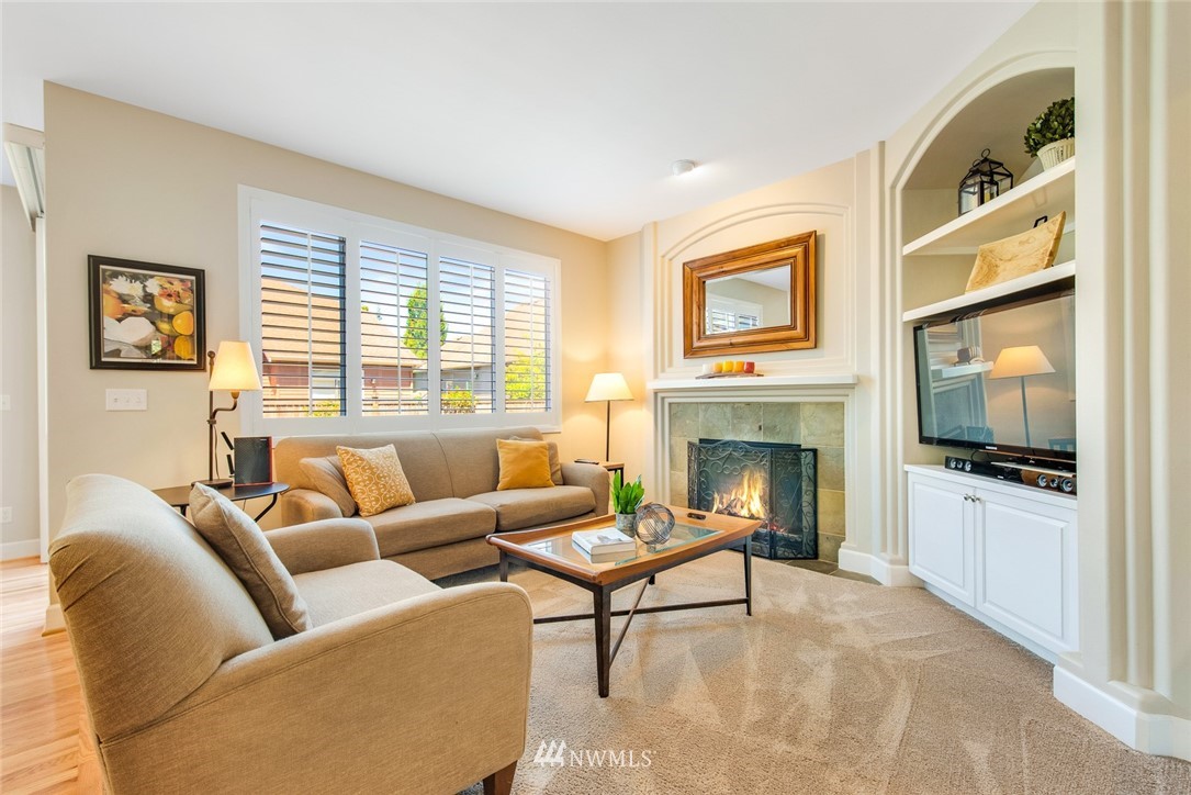 3613 209th Place Southeast Bothell, WA 98021 - Photo 11 of 28 a living room with furniture a fireplace and flat screen tv