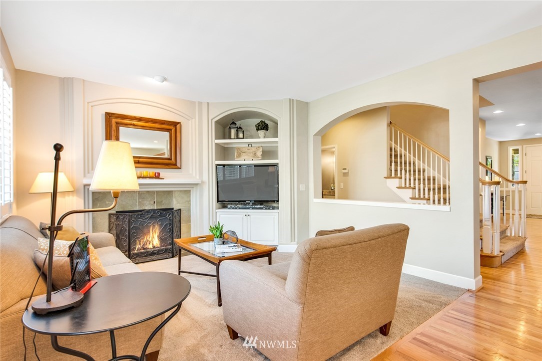 3613 209th Place Southeast Bothell, WA 98021 - Photo 12 of 28 a living room with fireplace furniture and a flat screen tv