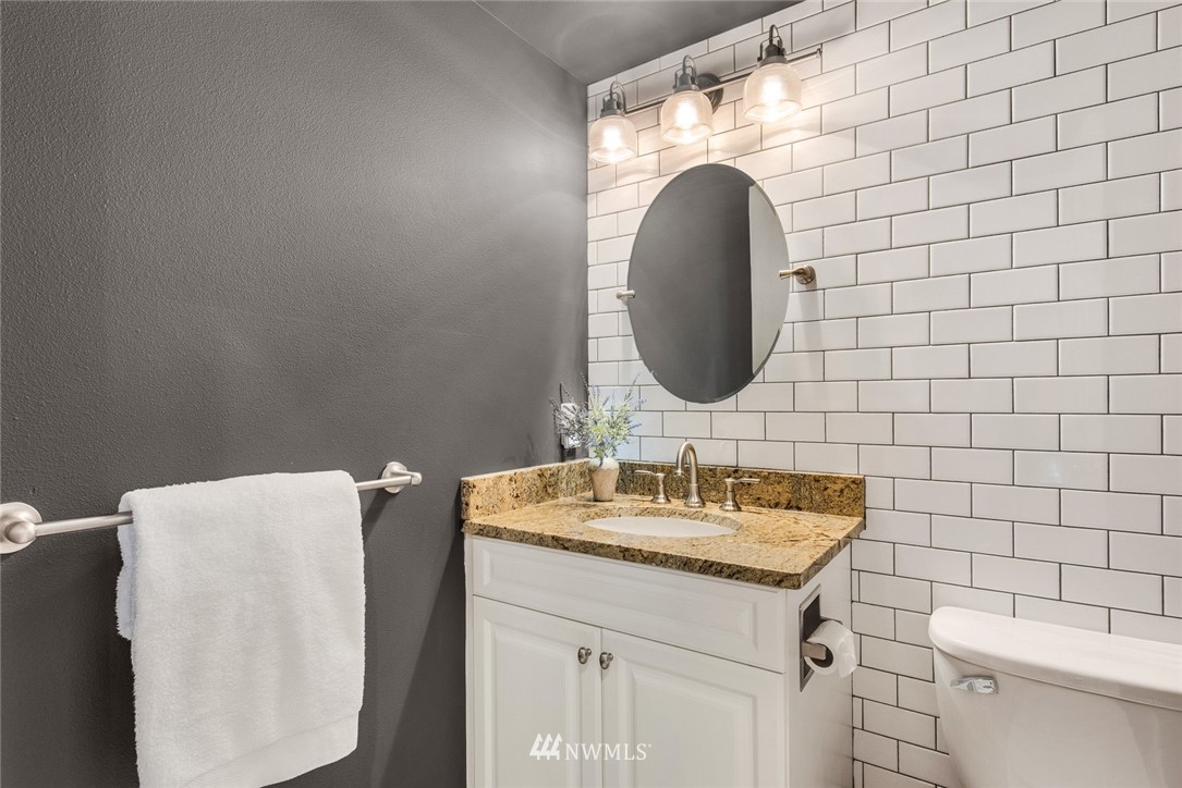 3613 209th Place Southeast Bothell, WA 98021 - Photo 13 of 28 a bathroom with a sink vanity and a mirror