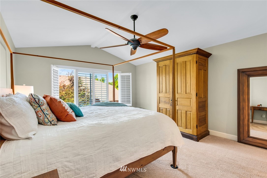 3613 209th Place Southeast Bothell, WA 98021 - Photo 16 of 28 a bed sitting in a bedroom next to a window