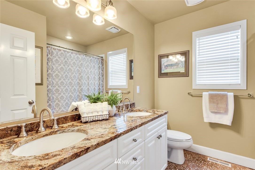 3613 209th Place Southeast Bothell, WA 98021 - Photo 21 of 28 a bathroom with a granite countertop double vanity sink mirror and toilet