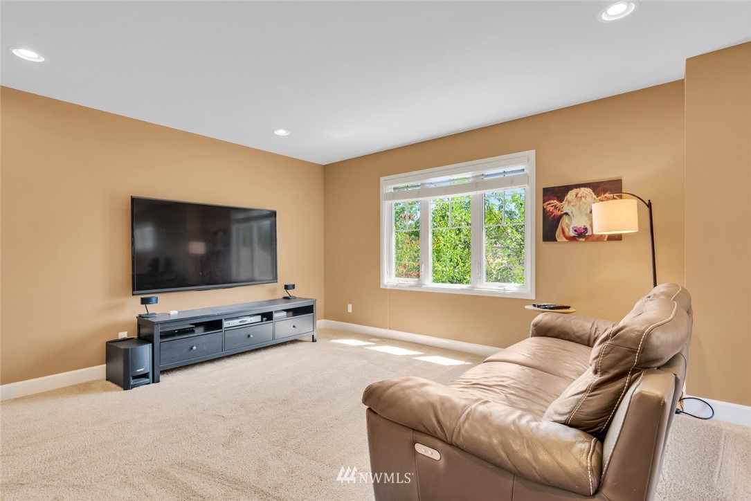 3613 209th Place Southeast Bothell, WA 98021 - Photo 25 of 28 a living room with furniture and a flat screen tv