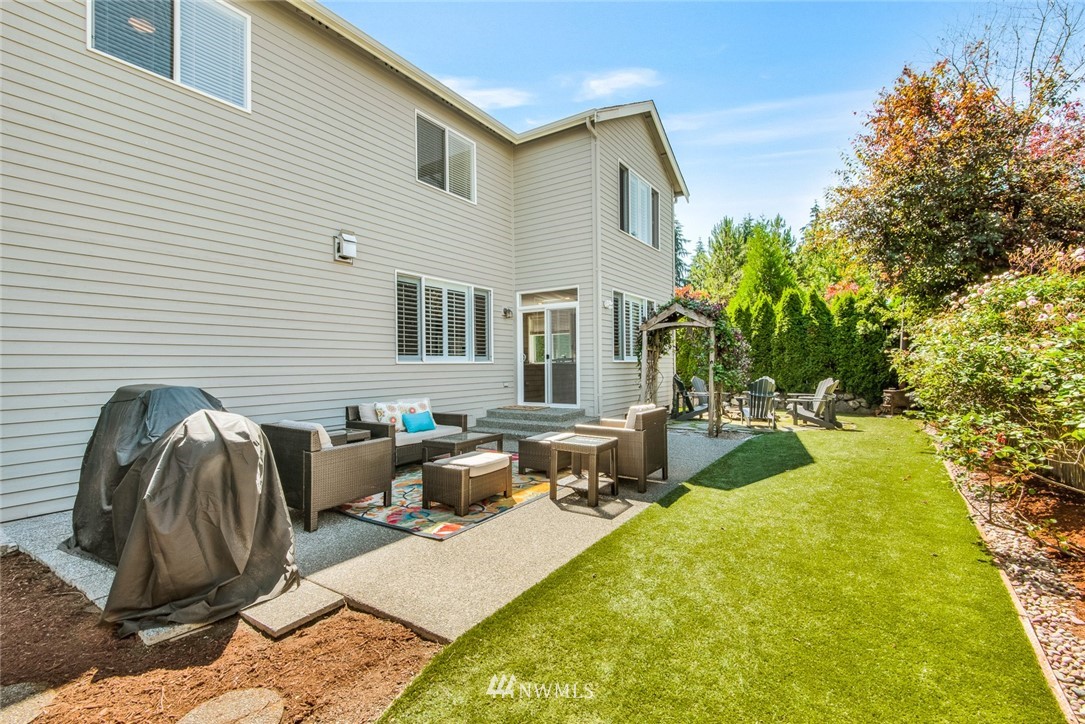 3613 209th Place Southeast Bothell, WA 98021 - Photo 27 of 28 a view of a patio with couches and potted plants