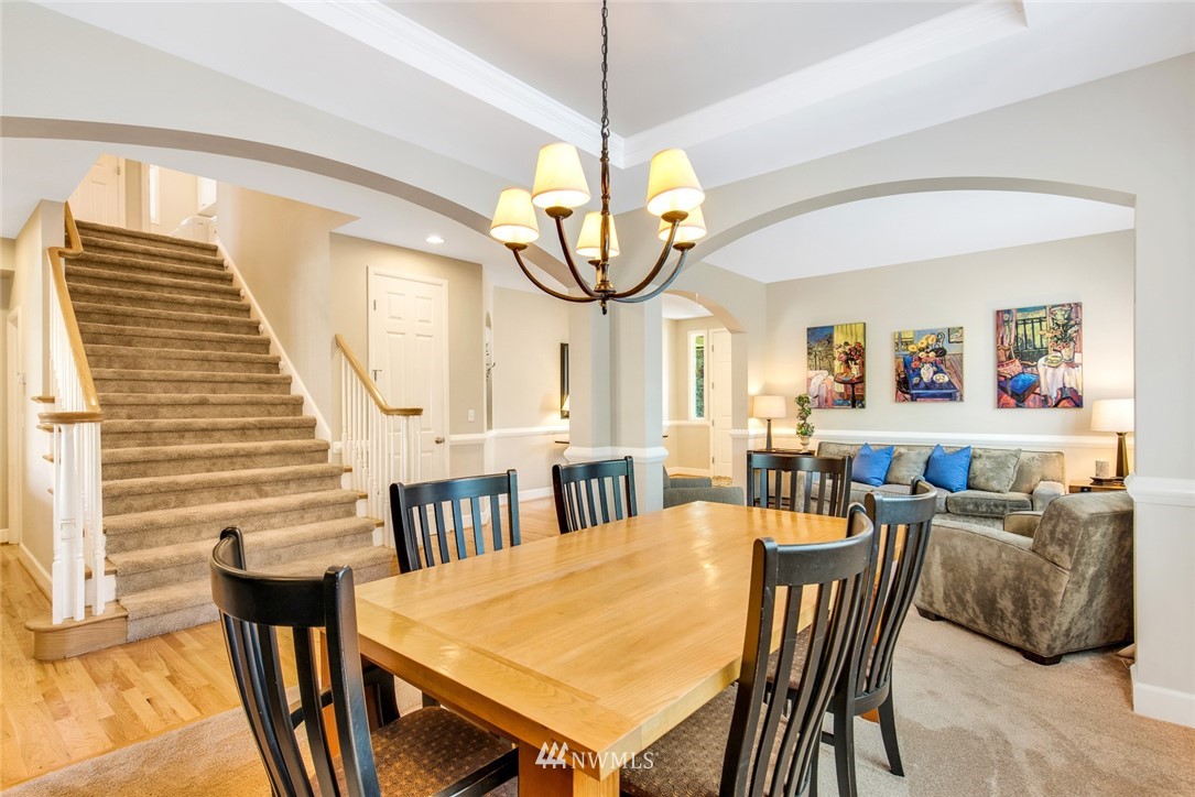 3613 209th Place Southeast Bothell, WA 98021 - Photo 7 of 28 a view of a dining room with furniture and wooden floor