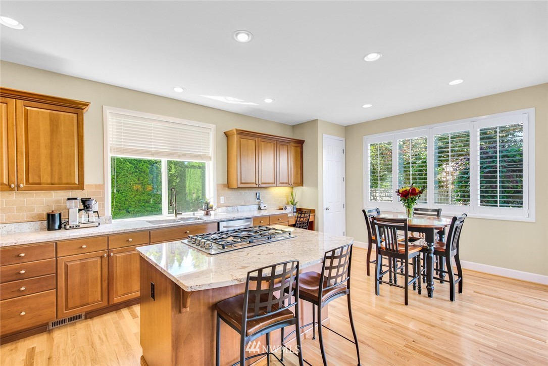 3613 209th Place Southeast Bothell, WA 98021 - Photo 8 of 28 a kitchen that has a table and chairs in it