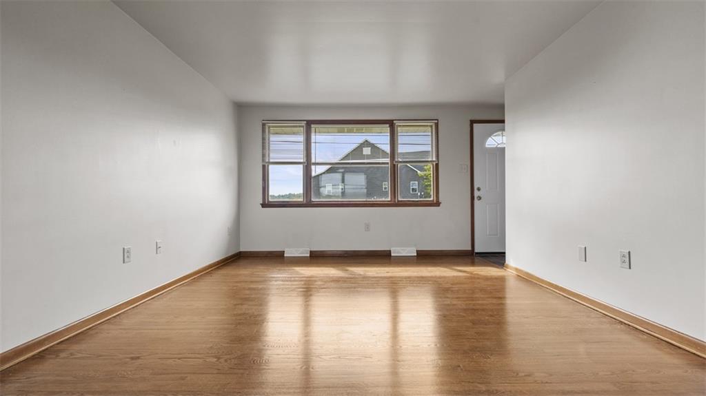 119 Linden Road Canonsburg, PA 15317 - Photo 9 of 41 an empty room with wooden floor and windows
