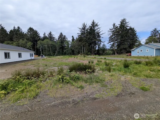 a roof deck with table and chairs