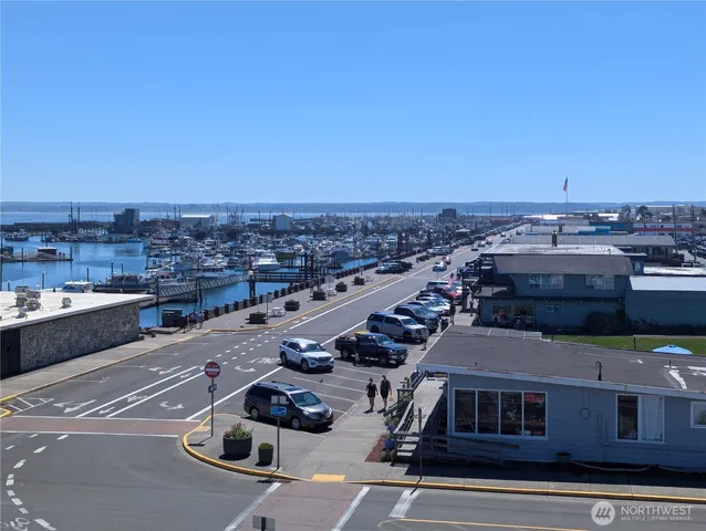 a view of room with wooden floor