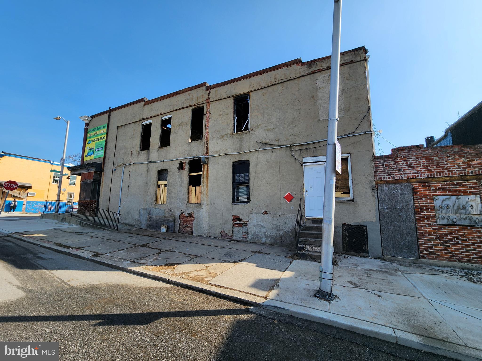 2401 East Biddle Street Baltimore, MD 21213 - Photo 7 of 7 a front view of a house with a yard