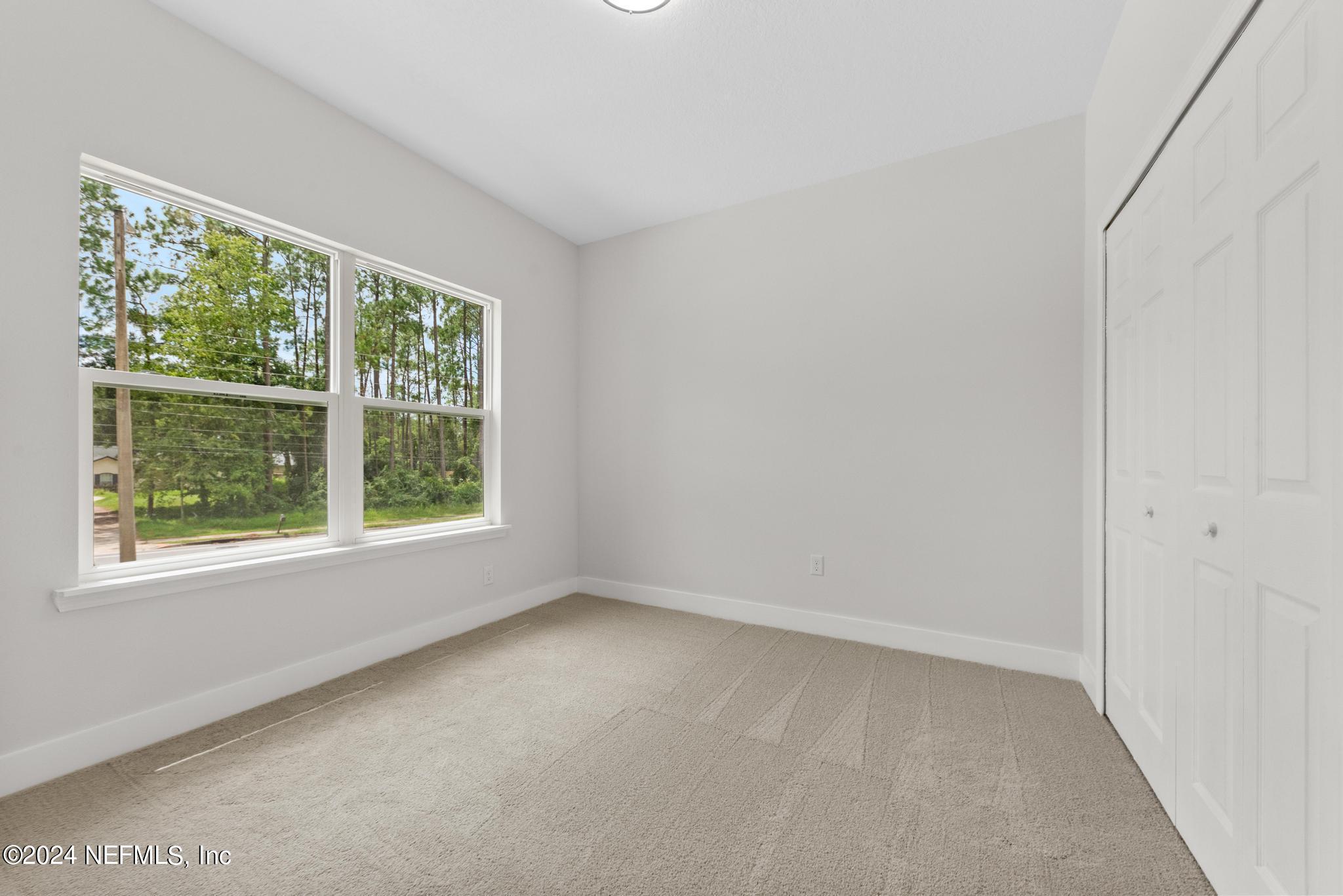 12731 Old St Augustine Road Jacksonville, FL 32258 - Photo 18 of 24 an empty room with a window