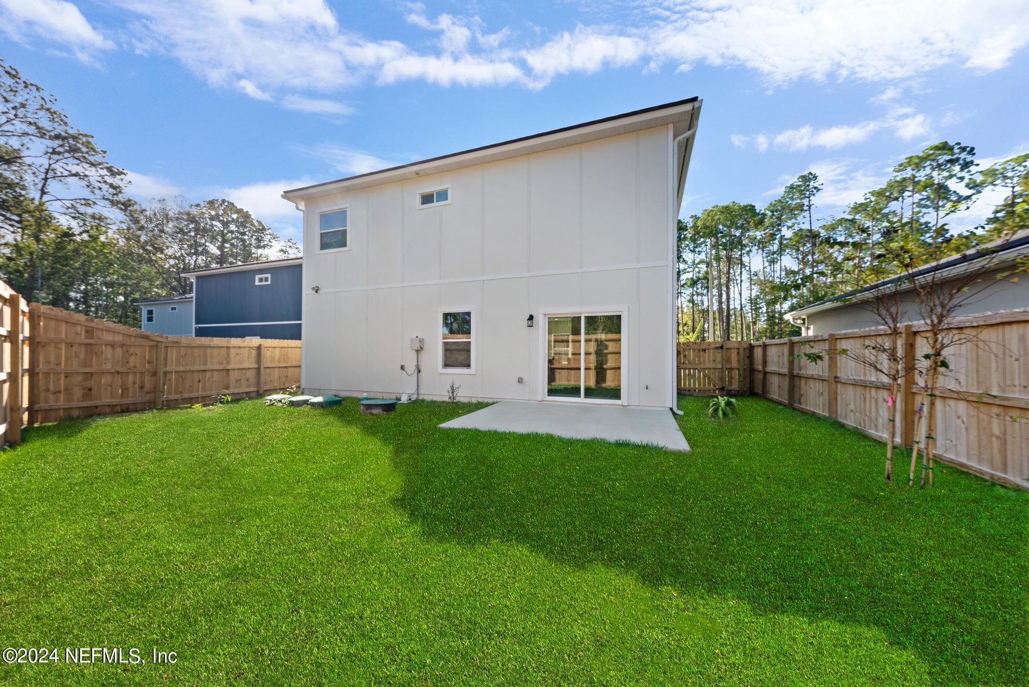 12731 Old St Augustine Road Jacksonville, FL 32258 - Photo 24 of 24 a view of a backyard with plants and a garden