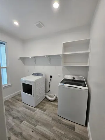 a utility room with washer and dryer