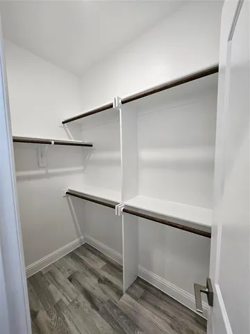 a view of an empty walk in closet