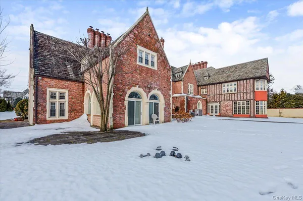 an aerial view of a house with a swimming pool