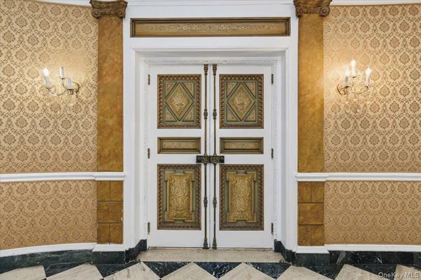 a view of a hallway with a black and white checkered floor