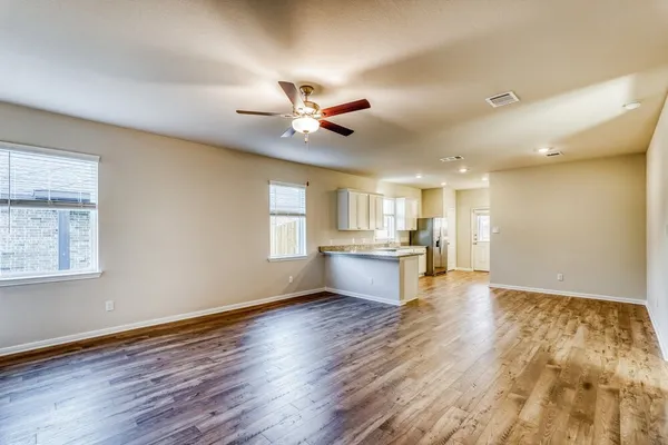 a view of kitchen with wooden floor and window