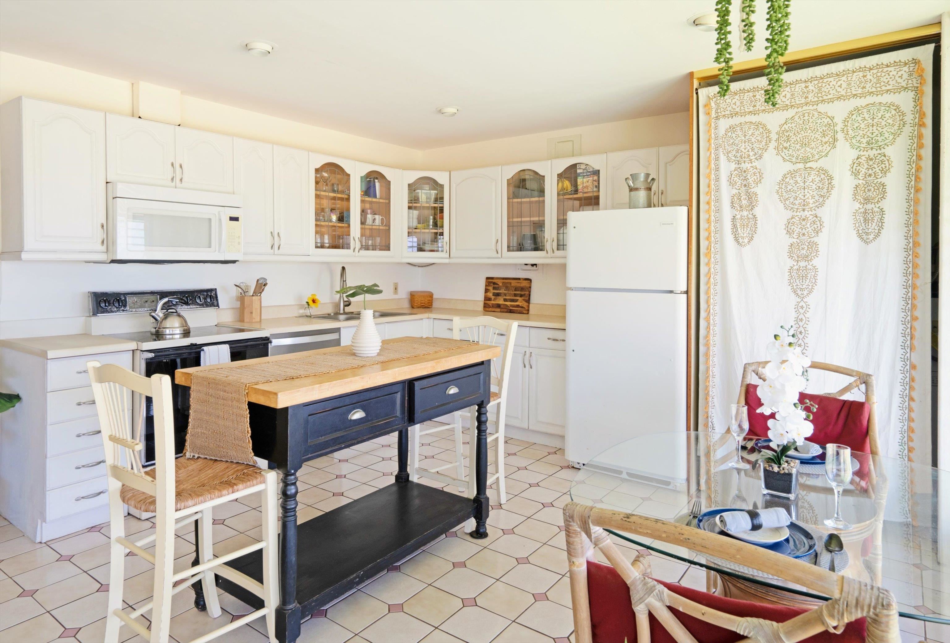 1002 South Kihei Road, Unit 314 Kihei, HI 96753 - Photo 11 of 31 a kitchen with a sink appliances and cabinets