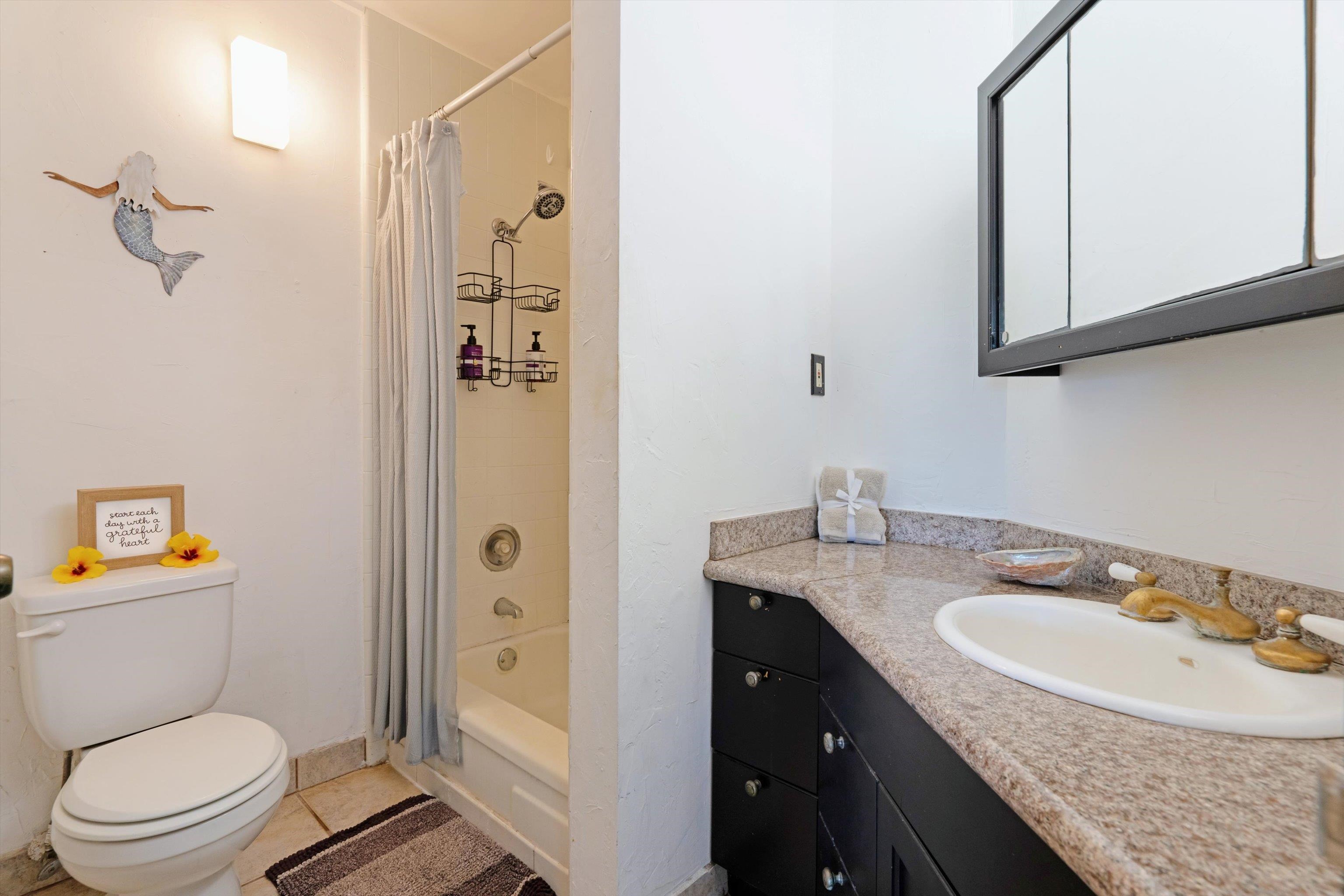 1002 South Kihei Road, Unit 314 Kihei, HI 96753 - Photo 14 of 31 a bathroom with a granite countertop sink toilet and shower