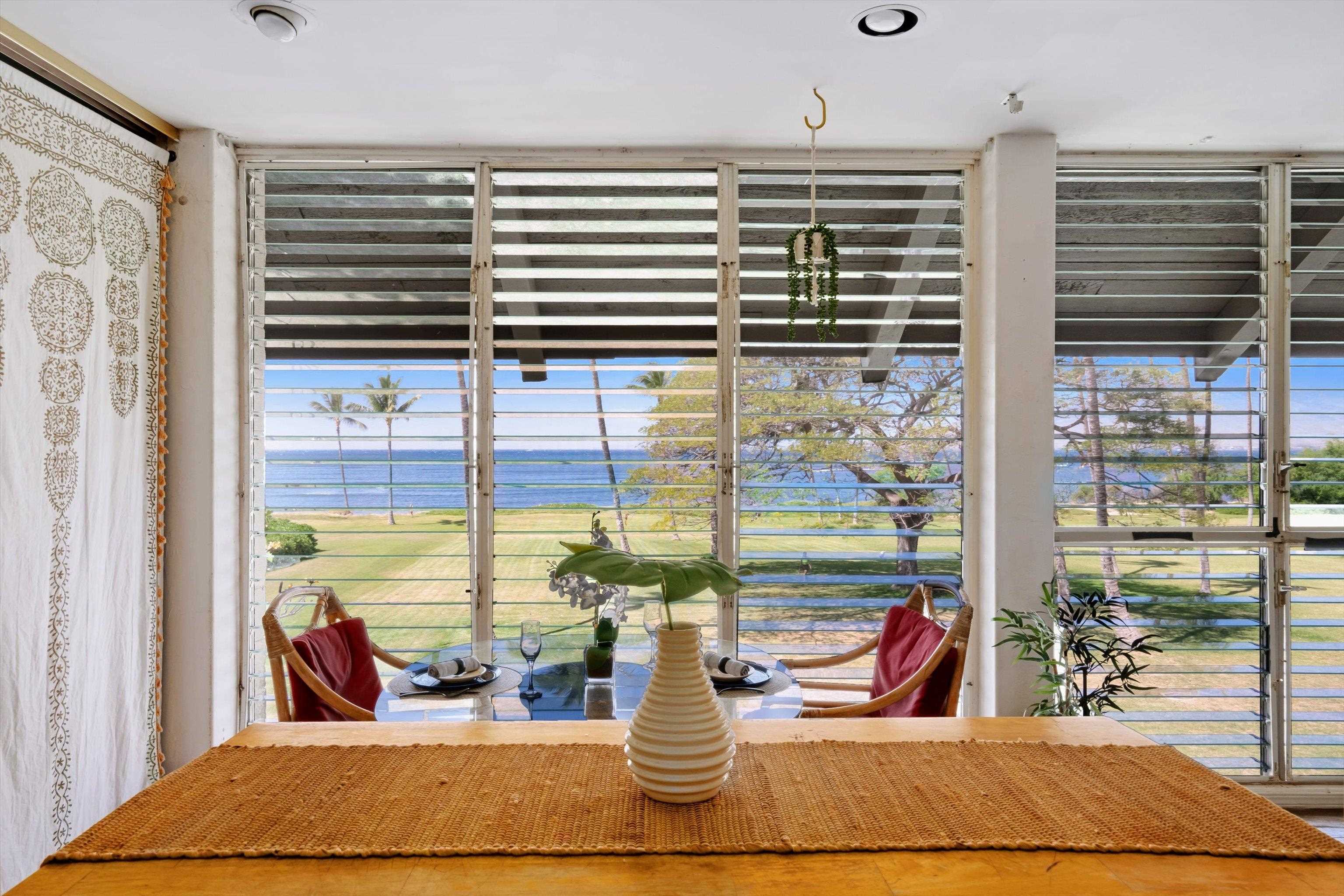 1002 South Kihei Road, Unit 314 Kihei, HI 96753 - Photo 15 of 31 a room with two large window and a bed