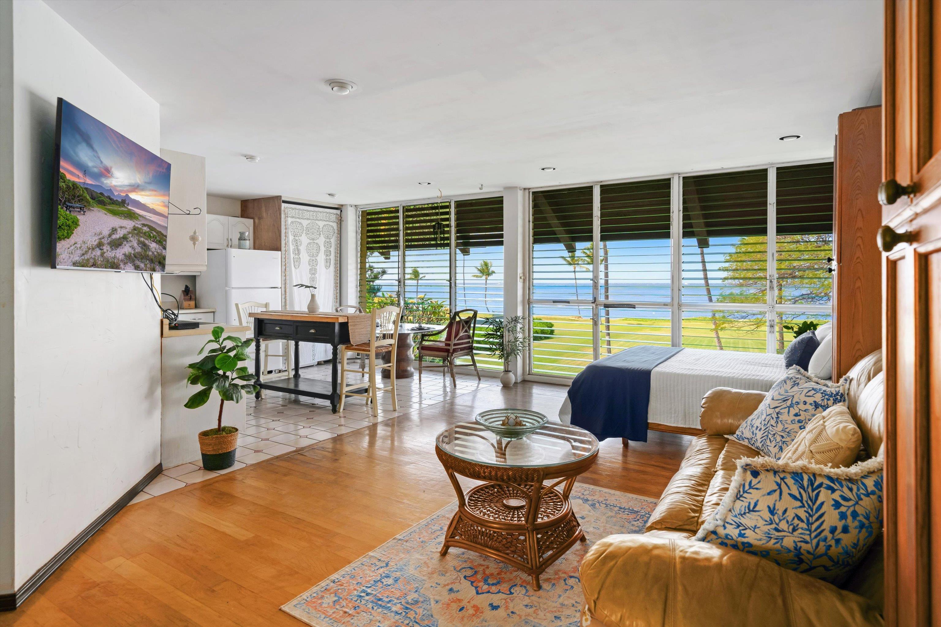 1002 South Kihei Road, Unit 314 Kihei, HI 96753 - Photo 17 of 31 a living room with furniture and a large window