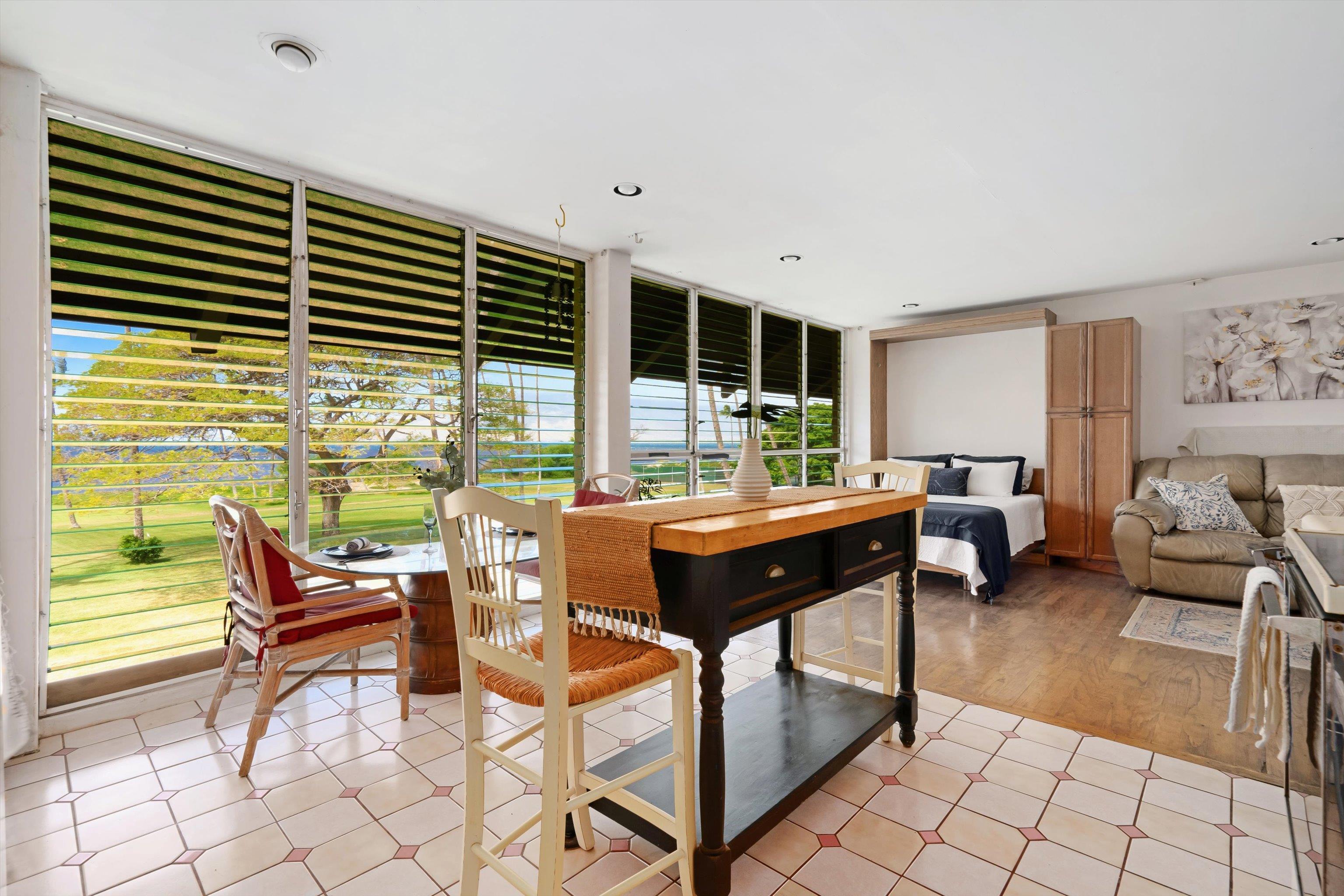 1002 South Kihei Road, Unit 314 Kihei, HI 96753 - Photo 18 of 31 a living room with furniture and large windows