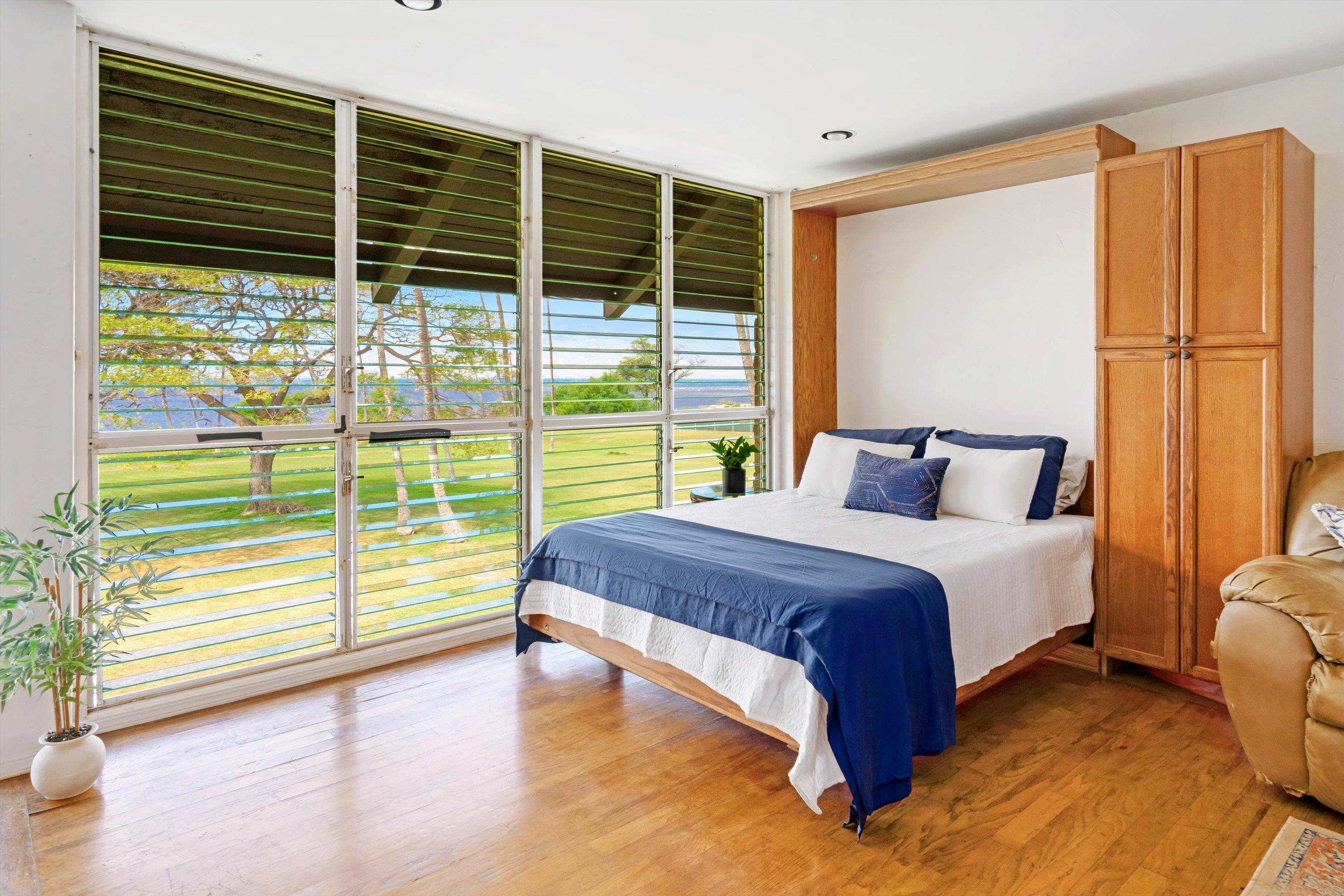 1002 South Kihei Road, Unit 314 Kihei, HI 96753 - Photo 2 of 31 a spacious bedroom with a large window and a balcony