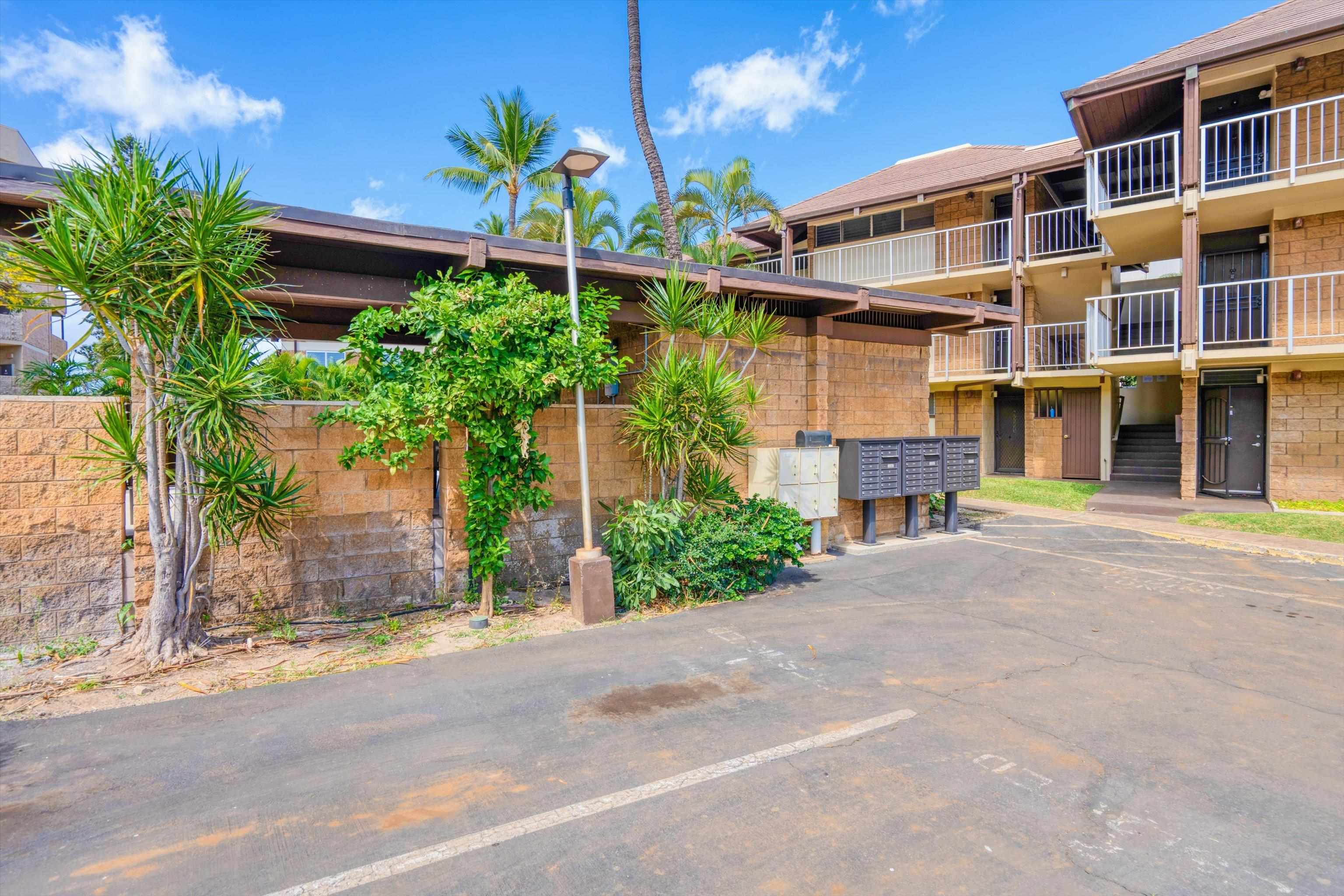 1002 South Kihei Road, Unit 314 Kihei, HI 96753 - Photo 23 of 31 a front view of a building with a garden