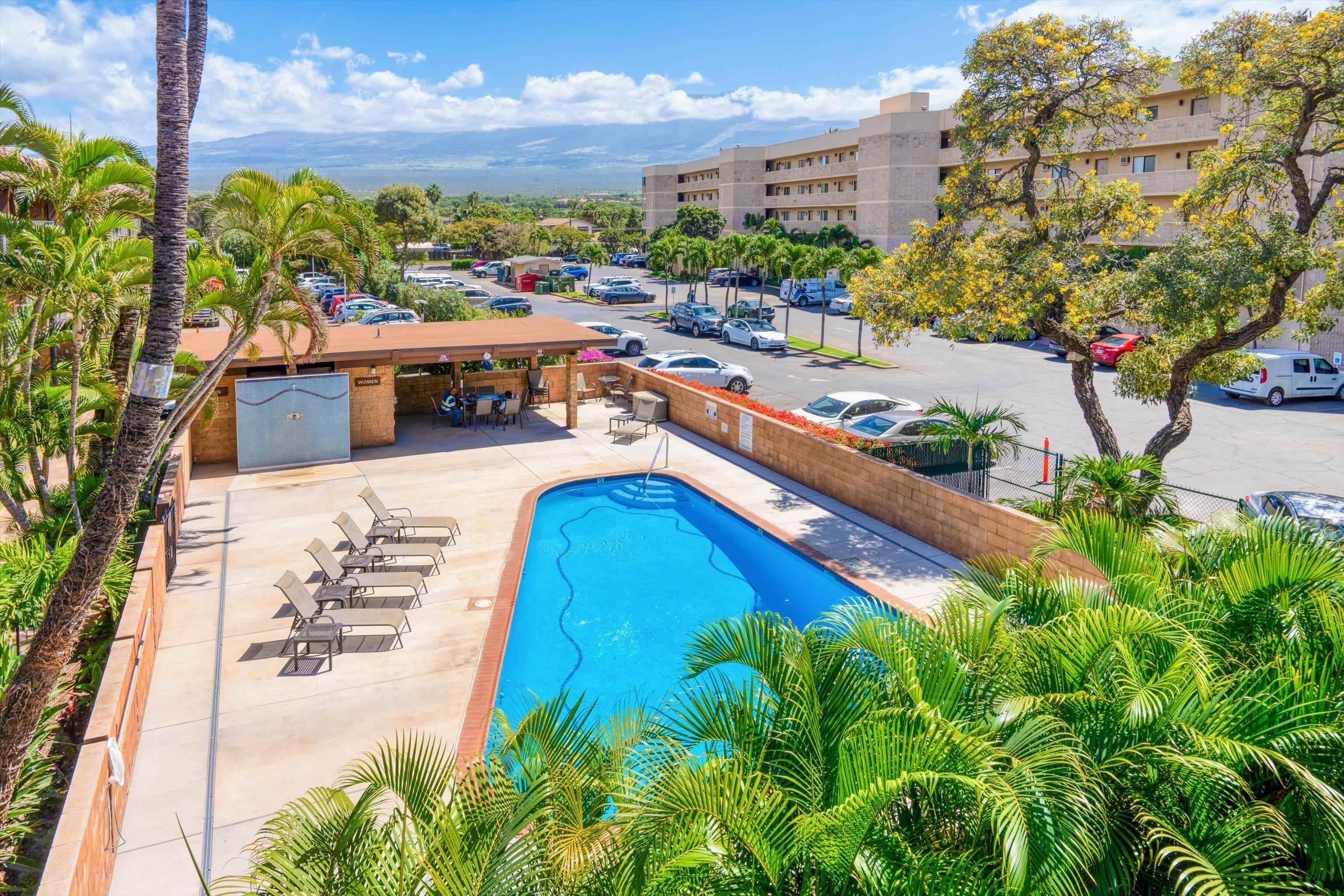 1002 South Kihei Road, Unit 314 Kihei, HI 96753 - Photo 4 of 31 a view of a swimming pool with an outdoor seating