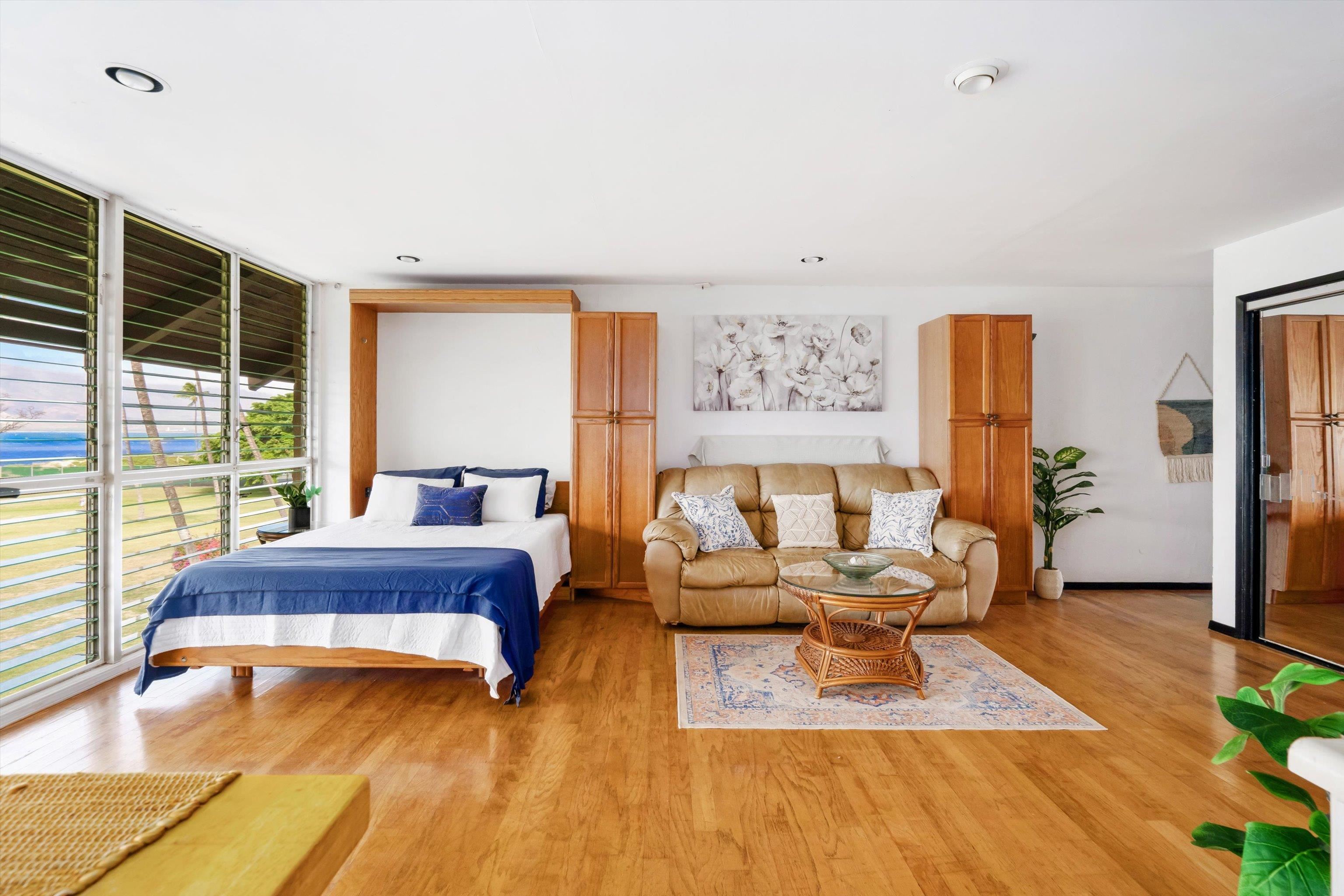 1002 South Kihei Road, Unit 314 Kihei, HI 96753 - Photo 10 of 31 a living room with furniture and a large window