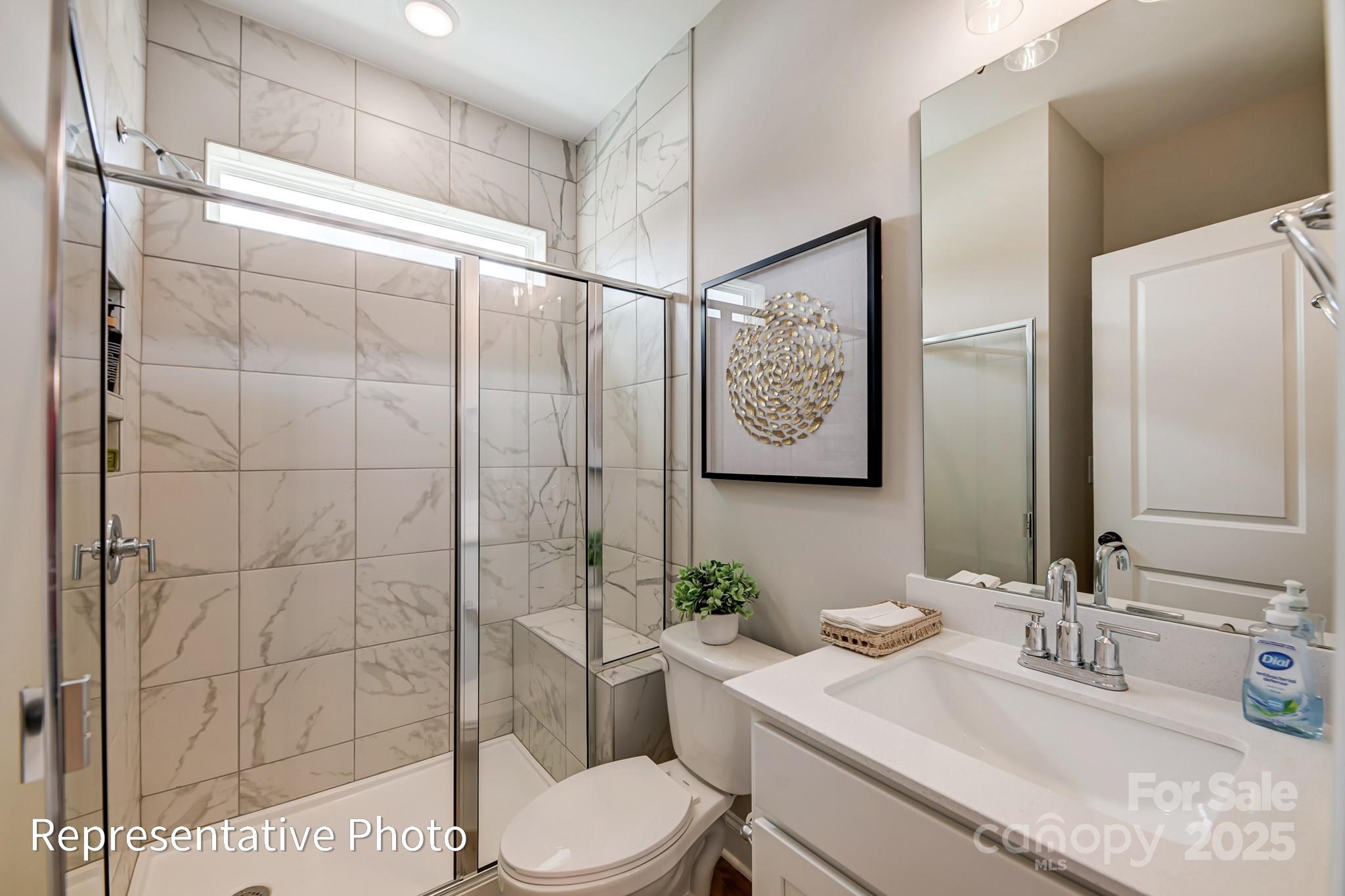 5038 Mclaughlin Loop Waxhaw, NC 28173 - Photo 12 of 25 a bathroom with a sink toilet and shower