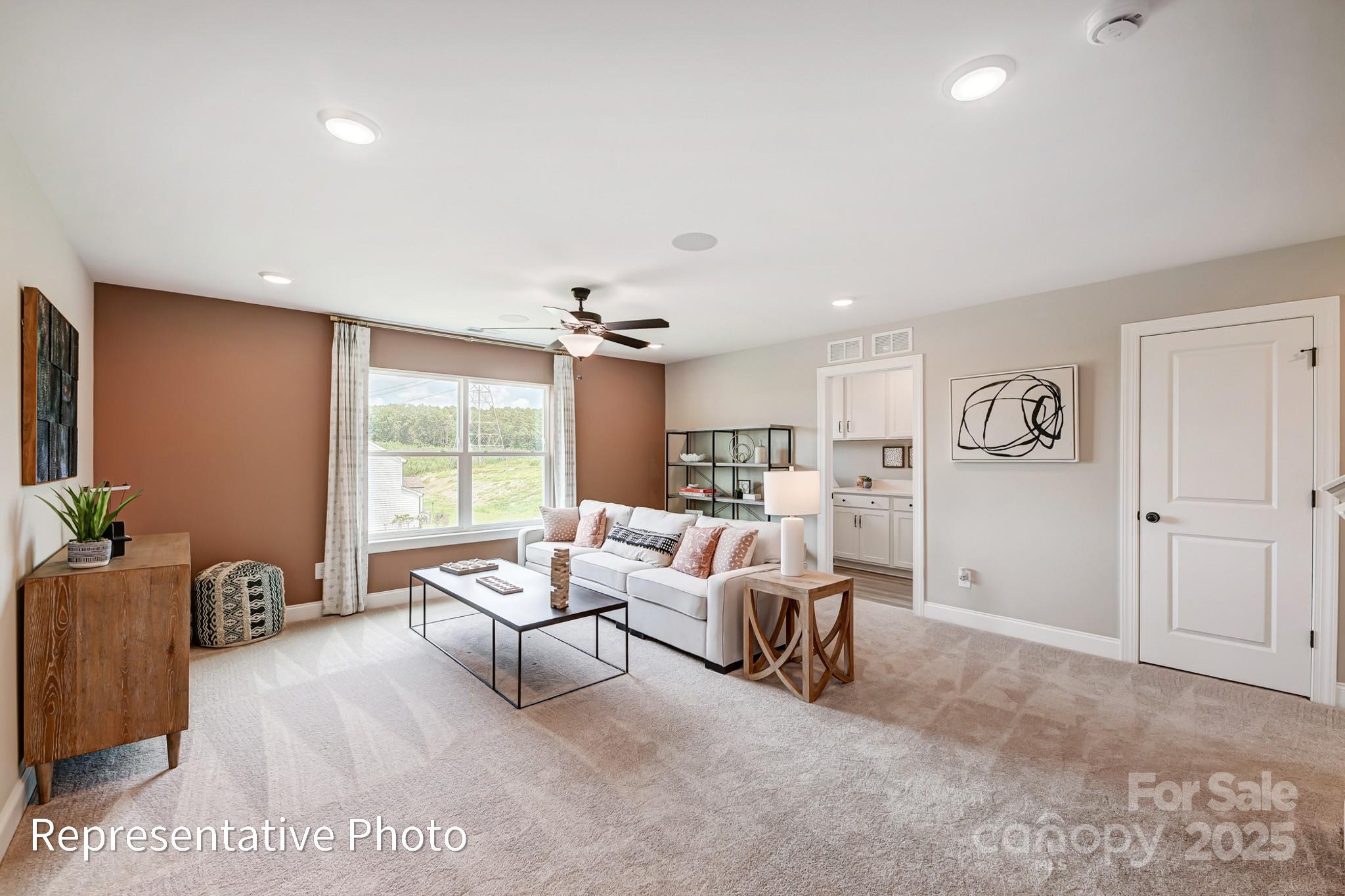 5038 Mclaughlin Loop Waxhaw, NC 28173 - Photo 13 of 25 a living room with furniture and a large window