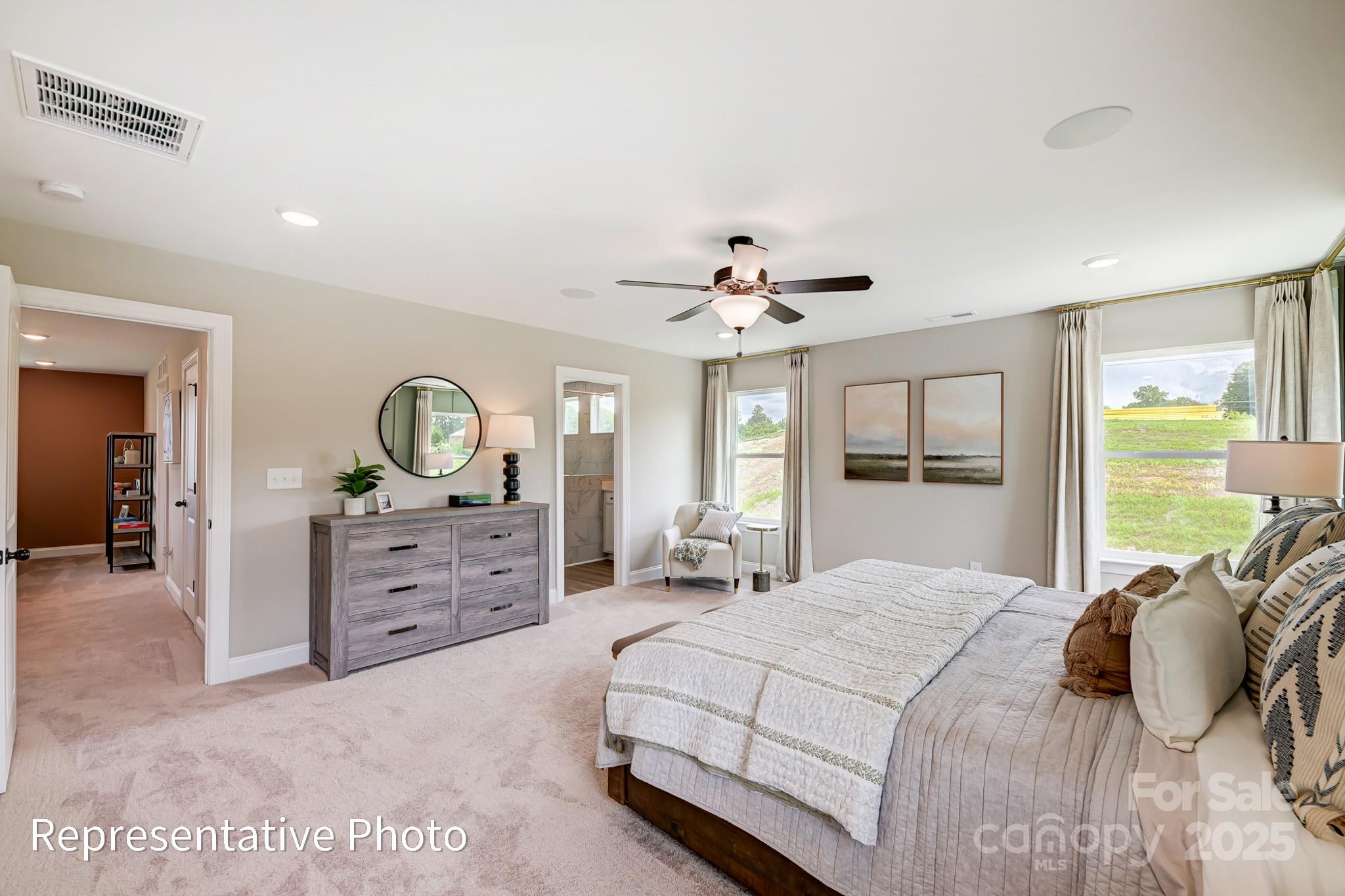 5038 Mclaughlin Loop Waxhaw, NC 28173 - Photo 16 of 25 a bedroom with a bed and a dresser