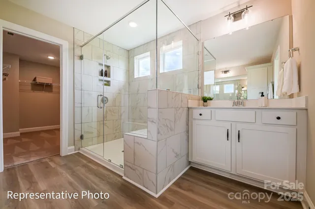 a bathroom with a shower and a sink