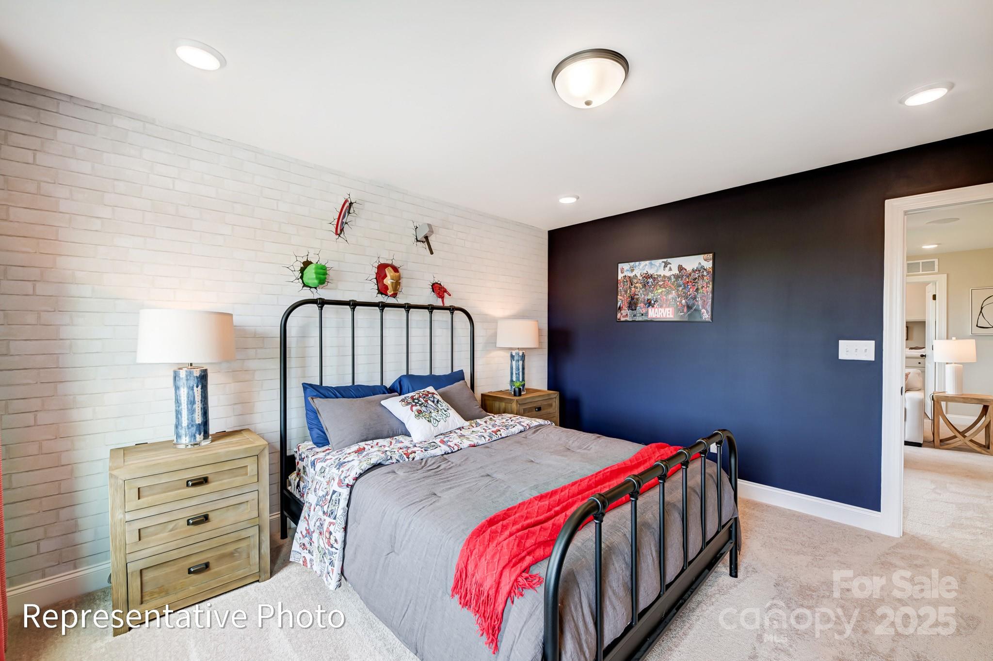 5038 Mclaughlin Loop Waxhaw, NC 28173 - Photo 20 of 25 a bedroom with a bed and a lamp