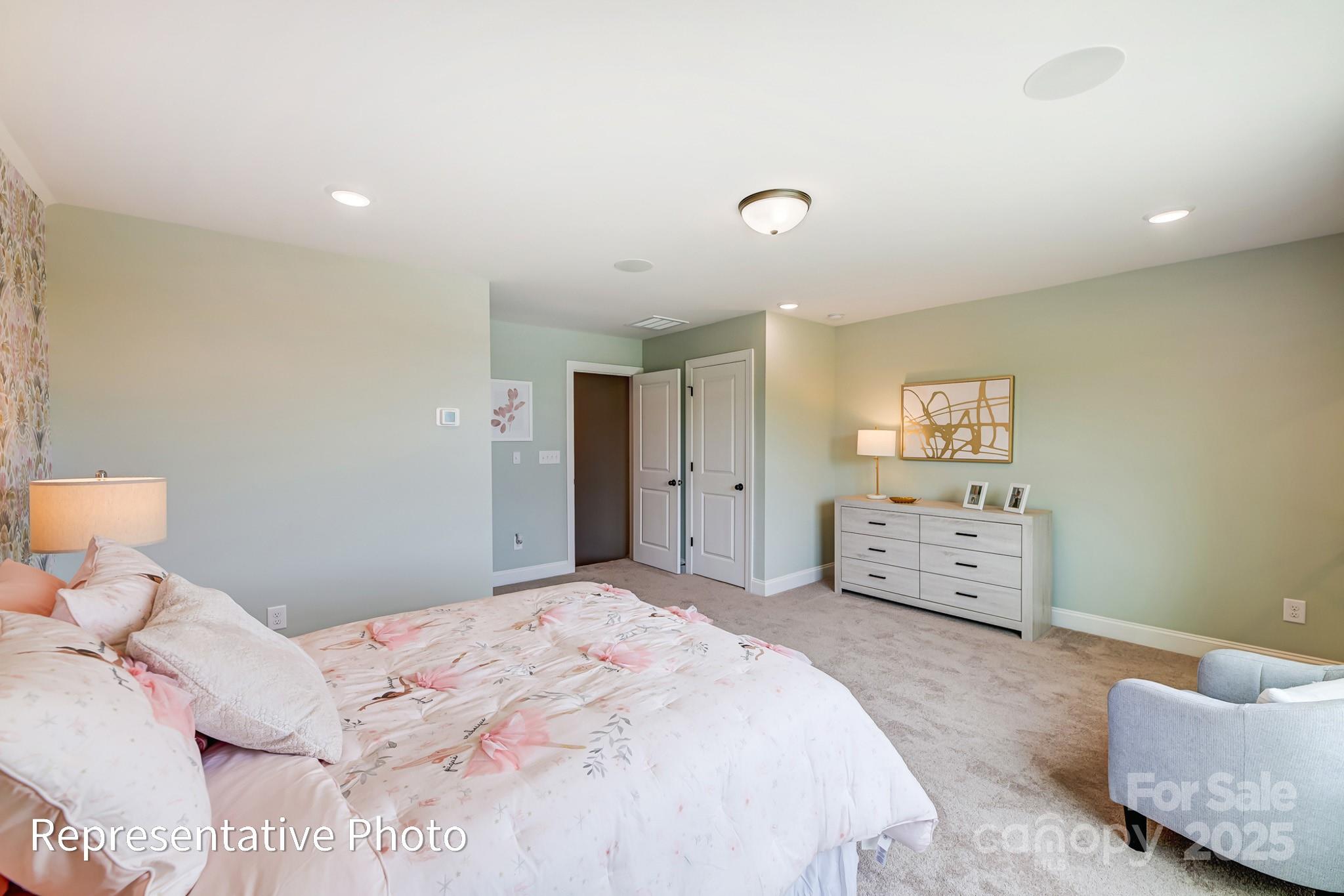 5038 Mclaughlin Loop Waxhaw, NC 28173 - Photo 23 of 25 a bedroom with a bed and a couch